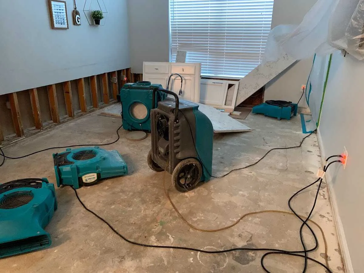 Dehumidifier in flood-cut room for Water Damage Restoration in Flower Hill
